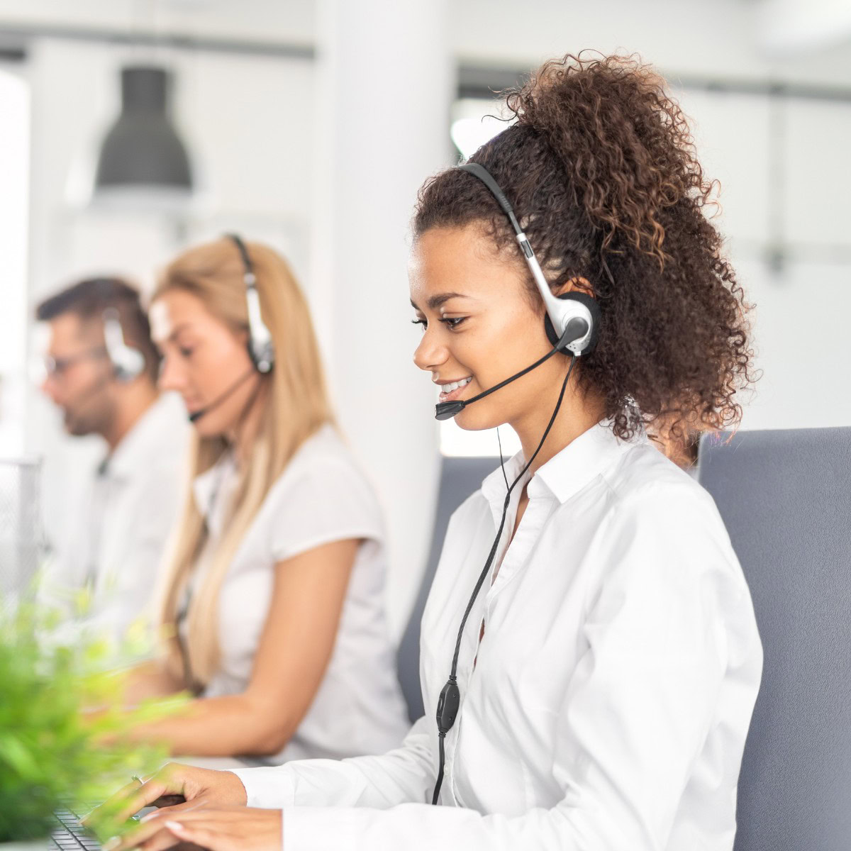 Insurance onboarding support team assisting new agents with systems and client processes